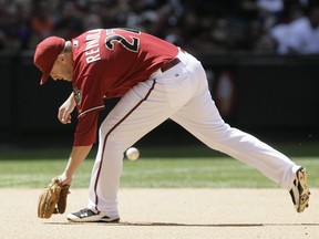 Arizona Diamondbacks third baseman Mark Reynolds cannot make a play on a ground ball at Chase Field in Phoenix on Sunday, May 23, 2010.