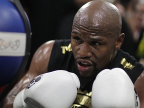 Boxer Floyd Mayweather Jr. goes through moves during a media workout at the Mayweather Boxing Club on Aug. 10, 2017 in Las Vegas.