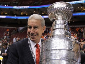 President of the Chicago Blackhawks John McDonough hoists the Stanley Cup after the Blackhawks defeated the Philadelphia Flyers 4-3 in overtime to win the Stanley Cup in Game Six of the 2010 NHL Stanley Cup Final at the Wachovia Center on June 9, 2010, in Philadelphia, Pa.
