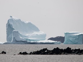 A large iceberg floats in the Atlantic Ocean, April 26, 2017 off the coast of Ferryland, Newfoundland.