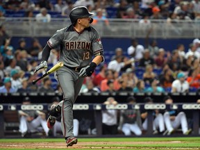 Arizona Diamondbacks shortstop Nick Ahmed (13) hits a grand slam against the Miami Marlins at Marlins Park. (Steve Mitchell-USA TODAY Sports)