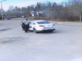 This photo showing the gunman changing clothes beside a replica RCMP vehicle was released as the Nova Scotia RCMP provided an update on Tuesday, April 28, 2020.