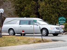 A hearse leaves Pinecrest Nursing Home after numerous residents died and dozens of staff were infected with coronavirus disease (COVID-19) in Bobcaygeon, Ont., March 31, 2020.