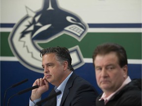 Vancouver Canucks head coach Travis Green, left, and GM Jim Benning say they remain hopeful of resuming the NHL season that was paused on March 12 due to the COVID-19 pandemic.