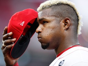 Yasiel Puig of the Cincinnati Reds reacts in the eighth inning against the Colorado Rockies at Great American Ball Park on July 26, 2019, in Cincinnati, Ohio.