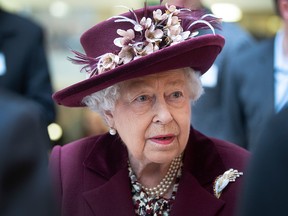 Queen Elizabeth II talks with MI5 officers during a visit to the headquarters of MI5 at Thames House on Feb. 25, 2020, in London, England.