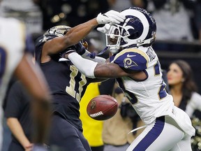 Tommylee Lewis of the New Orleans Saints drops a pass broken up by Nickell Robey-Coleman of the Los Angeles Rams during the fourth quarter in the NFC Championship game at the Mercedes-Benz Superdome on Jan. 20, 2019 in New Orleans. (Photo by /)