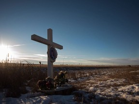 A memorial to a previous crash marks the intersection at Wanuskewin Rd and Highway 11, outside of Saskatoon.