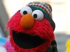 An Elmo muppet is seen on the Sesame Street float during the 86th Macy's Thanksgiving day parade in New York, Nov. 22, 2012.