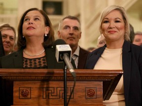 Sinn Fein party leader Mary Lou McDonald (left) speaks while flanked by deputy leader Michelle O'Neill and other colleagues during a media conference in Belfast on January 10, 2020. (PAUL FAITH/AFP via Getty Images)