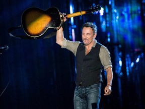 In this file photo taken on November 11, 2014 Bruce Springsteen performs during "The Concert for Valor" on the National Mall in Washington. (BRENDAN SMIALOWSKI/AFP/Getty Images)