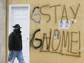 Masks, signs and boarded up stores continue during COVID-19 in Toronto on Wednesday, April 15, 2020.