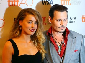 Johnny Depp with his wife Amber Heard on the red carpet for movie "Black Mass" during the Toronto International Film Festival in Toronto, Sept. 11, 2015.