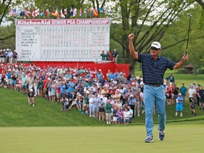 Ken Tanigawa celebrates after making a par on the 18th hole during the final round to win the KitchenAid Senior PGA Championship at Oak Hill Country Club on May 26, 2019, in Rochester, N.Y.