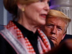 U.S. President Donald Trump takes questions from members of the media beside Debbie Birx, the White House coronavirus response coordinator, during a daily briefing at the White House in Washington April 2, 2020. (REUTERS/Tom Brenner)