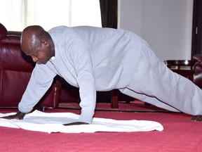 Ugandan President Yoweri Museveni does push-ups to keep fit at the State House, in Entebbe, Uganda April 9, 2020. (Presidential Press Unit/Handout via REUTERS)