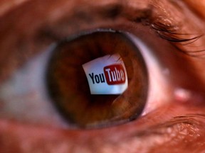 A picture illustration shows a YouTube logo reflected in a person's eye June 18, 2014. The picture was flipped horizontally.