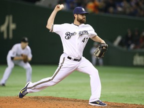 Rob Wooten of the Milwaukee Brewers pitches in the sixth inning during the game four of Samurai Japan and MLB All Stars at Tokyo Dome on Nov. 16, 2014, in Tokyo, Japan.