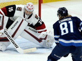Winnipeg Jets forward Kyle Connor moves in on Arizona Coyotes goaltender Darcy Kuemper in Winnipeg on Monday, March 9.