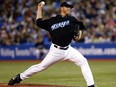 Late Toronto Blue Jays legend Roy Halladay throws a pitch during a 2005 game. A new book about Halladay has been released.
