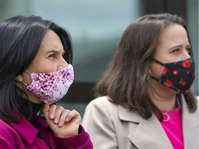 Mayor Valérie Plante, left, adjusts her mask as Montreal public health head Dr. Mylène Drouin answers questions during a visit to a city bus outfitted as a mobile COVID-19 testing clinic in Montreal on Tuesday, May 5, 2020.