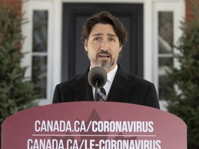 Prime Minister Justin Trudeau delivers his opening statement during a news conference outside Rideau Cottage, Tuesday, May 12, 2020 in Ottawa.