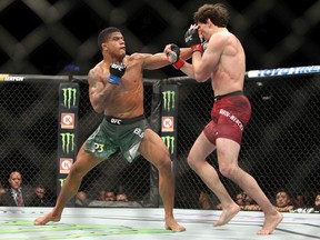 Olivier Aubin-Mercier (R) of Canada fights against Gilbert Burns of Brazil in a lightweight bout during the UFC 231 event at Scotiabank Arena on December 8, 2018 in Toronto, Canada.