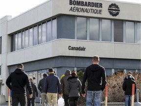 Workers return from lunch to the Bombardier plant on Marcel-Laurin Blvd. in 2018.