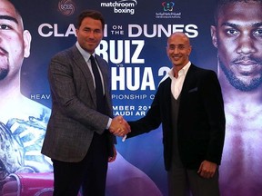 Eddie Hearn, managing director of Matchroom Sport and Omar Khalil, Managing Partner of Skill Challenge Entertainment, official event partner in The Kingdom of Saudi Arabia shake hands after a press conference to formally announce 'Clash on the Dunes' at The Savoy hotel on August 12, 2019 in London, England.