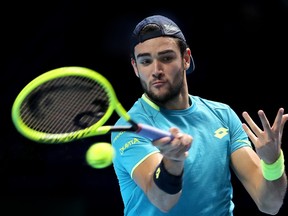 Matteo Berrettini of Italy plays a forehand in his singles match against Dominic Thiem of Austria during Day Five of the Nitto ATP World Tour Finals at The O2 Arena on November 14, 2019 in London, England.