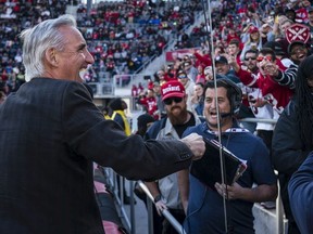 XFL Commissioner Oliver Luck interacts with fans while contributing to the beer cup snake during the second half of the XFL game between the DC Defenders and the St. Louis Battlehawks at Audi Field on March 8, 2020 in Washington, DC.