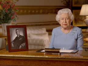 In this handout provided by Buckingham Palace, Queen Elizabeth II addresses the nation and the Commonwealth on the 75th anniversary of VE Day at Windsor Castle on May 8, 2020 in Windsor, England.