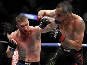 Justin Gaethje, left, punches Tony Ferguson in their Interim lightweight title fight during UFC 249 at VyStar Veterans Memorial Arena on May 9, 2020 in Jacksonville, Florida.