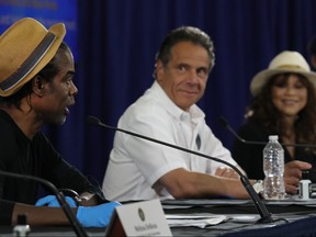 New York Governor Andrew Cuomo Is joined by Rosie Perez and Chris Rock at a press conference where the two performers helped to promote coronavirus testing, social distancing and the use of a face mask on May 28, 2020 in New York City.