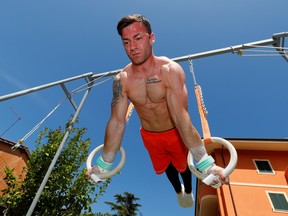 Italian gymnast Marco Lodadio, silver medallist in the 2019 men's World Artistic Gymnastics Championships, during a training session in his garden at home in Grottaferrata, following the outbreak of the coronavirus disease (COVID-19), Grottaferrata, Italy, May 9, 2020.