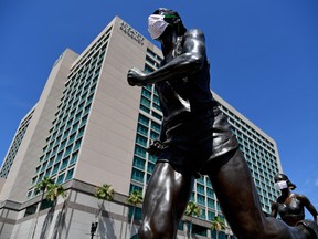 A general view of statues with protective masks on outside of the Hyatt Regency the host hotel for UFC 249 at VyStar Veterans Memorial Arena, May 9, 2020.