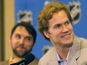 Chris Pronger, right, and Dwayne Roloson of the Edmonton Oilers share a laugh during an NHL Stanley Cup media availability at the Marriott Crabtree hotel in this file photo from June 4, 2006, in Raleigh, N.C.