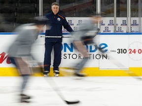 Edmonton Oilers head coach Dave Tippett watches his players during a practice on the ice at Rogers Place on Feb. 7, 2020.