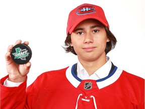 Alexander Romanov poses after being selected 38th overall by the Montreal Canadiens during the 2018 NHL Draft at American Airlines Center on June 23, 2018 in Dallas, Texas.