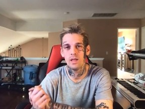 Aaron Carter says getting tattoos makes him look tougher.