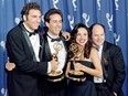 In this file photo taken on September 19, 1993 The cast of the Emmy-winning "Seinfeld" show (L-R) Michael Richards, Jerry Seinfeld, Julia Louis-Dreyfus and Jason Alexander pose with the Emmys they won for Outstanding Comedy Series on in Pasadena, California.