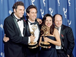 In this file photo taken on September 19, 1993 The cast of the Emmy-winning "Seinfeld" show (L-R) Michael Richards, Jerry Seinfeld, Julia Louis-Dreyfus and Jason Alexander pose with the Emmys they won for Outstanding Comedy Series on in Pasadena, California.