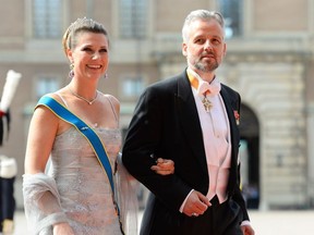 In this file photo taken on June 13, 2015 Norwegian Princess Martha Louise and her husband Ari Behn arrive for the wedding of Sweden's Crown Prince Carl Philip and Sofia Hellqvist at Stockholm Palace.
