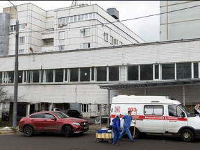 This file photo taken on April 2, 2020 shows The Spasokukotsky hospital No. 50, with the wing housing coronavirus patients seen in the background, in Moscow.