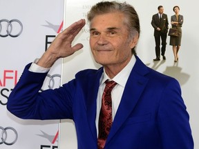 In this file photo taken on November 07, 2013, actor Fred Willard poses on arrival for the AFI Fest opening night gala screening of Disney's 'Saving Mr. Banks' in Hollywood.