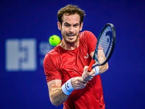 Andy Murray of Britain hits a return against Tennys Sandgren of the US during their men's singles first round match at the Zhuhai Championships tennis tournament in Zhuhai in China's southern Guangdong province on Sept. 24, 2019.