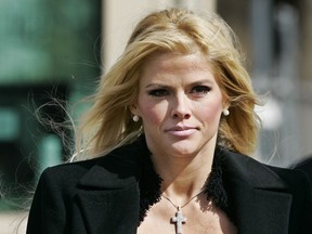 This Feb. 28, 2006 file photo shows actress-model Anna Nicole Smith leaving the U.S. Supreme Court in Washington.