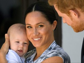 Britain's Prince Harry and his wife Meghan, Duchess of Sussex, holding their son Archie in Cape Town, South Africa, September 25, 2019.