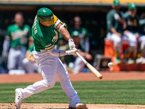 Athletics second baseman Franklin Barreto hits a three-run home run against the White Sox during first inning MLB action at Oakland Coliseum, in Oakland, Calif., on July 13, 2019.