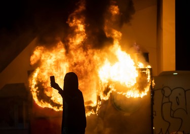 A building in Centennial Olympic Park burns during rioting and protests in Atlanta on May 29, 2020.